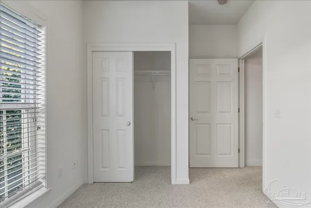 a view of an empty room with a bathroom