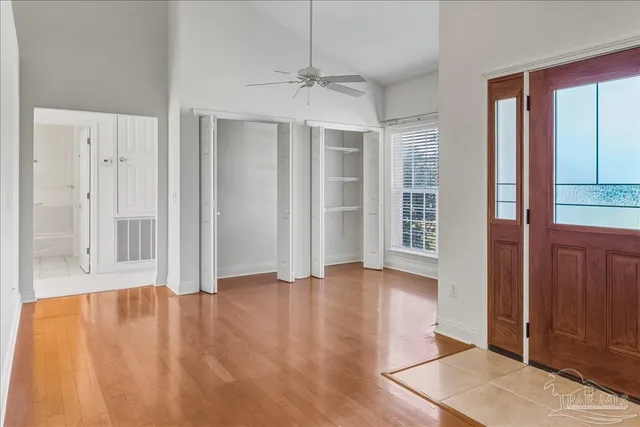 wooden floor in an empty room with a window