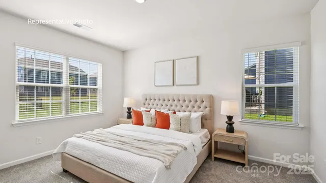 a bedroom with bed and a window