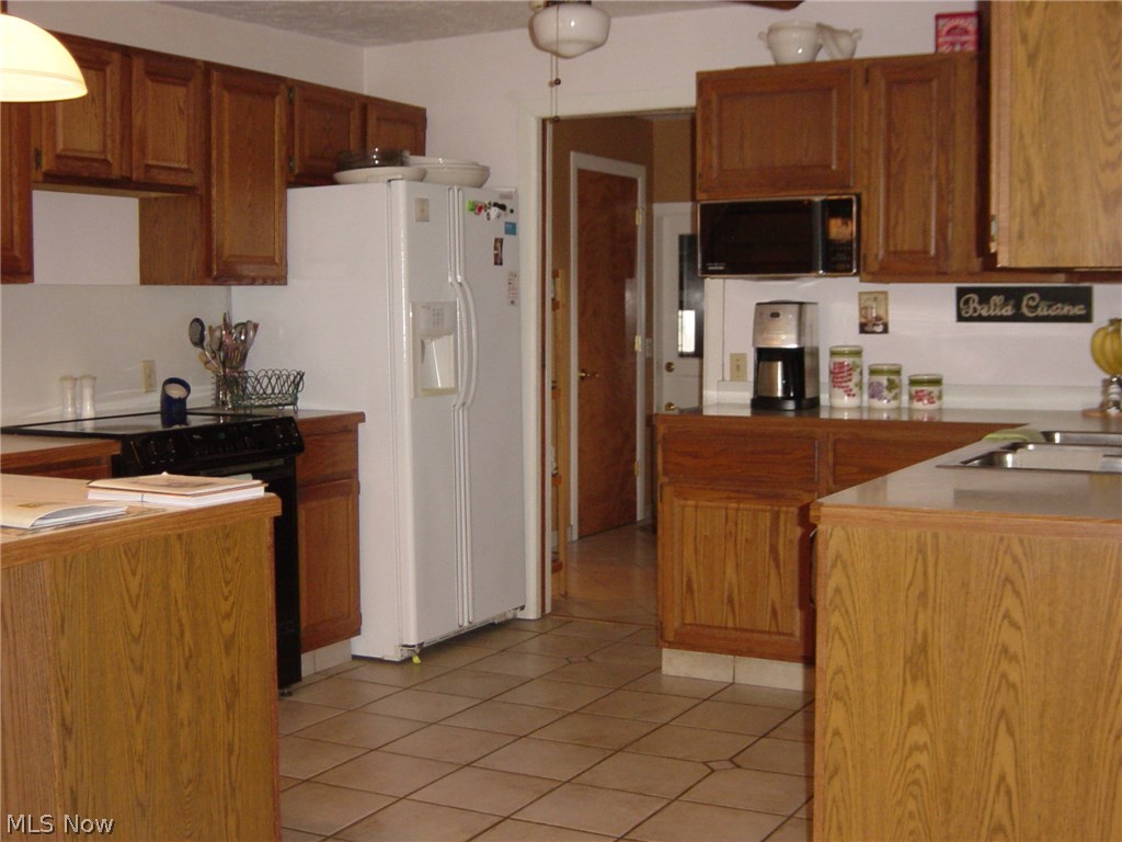 35650 Solon Road Solon, OH 44139 - Photo 2 of 14 The nice, open kitchen gives plenty of counter space, a closet pantry, and appliances that remain!