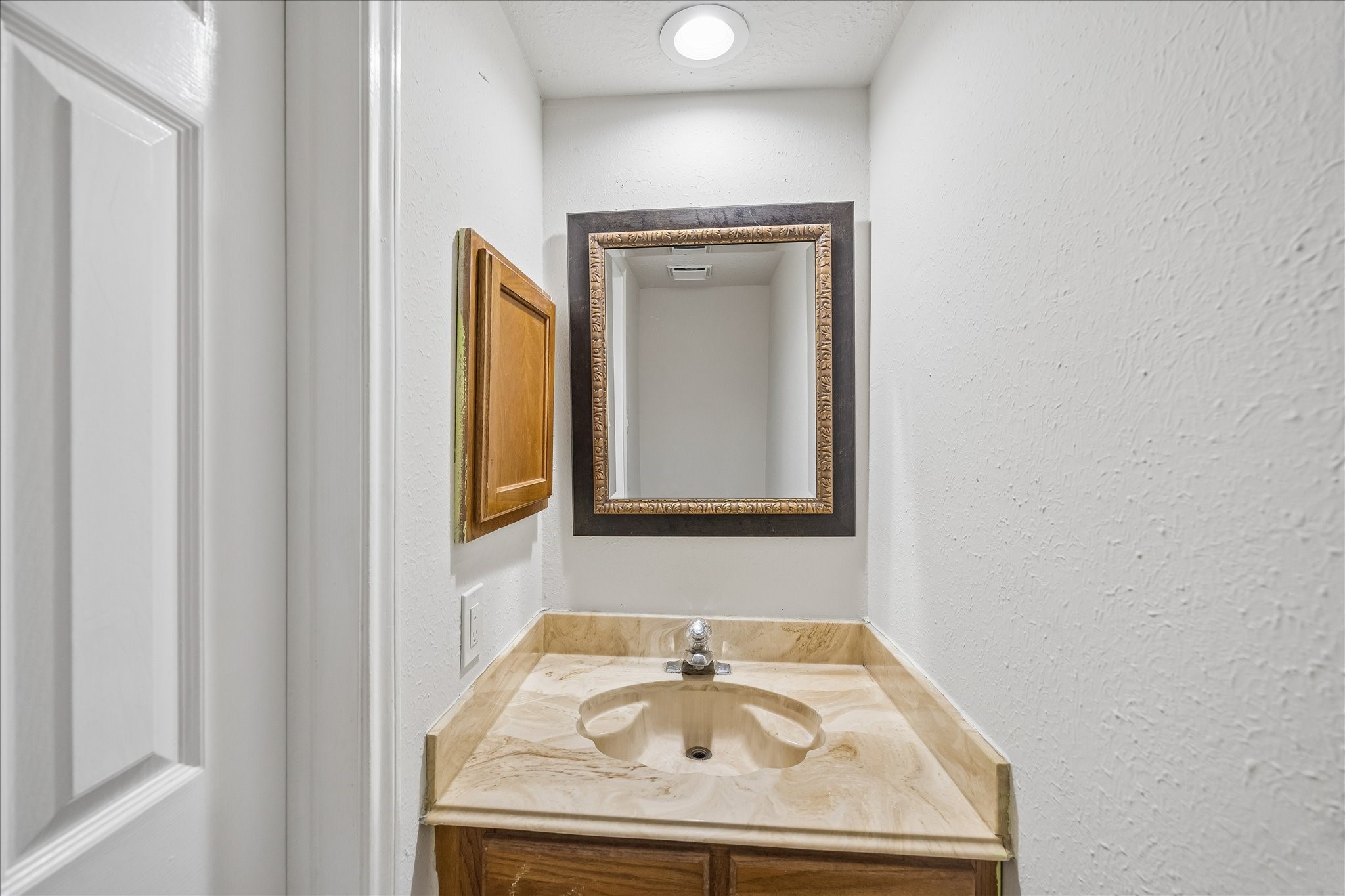 10411 Goodrum Road Houston, TX 77041 - Photo 13 of 25 Half bathroom is conveniently located downstairs for your guests.