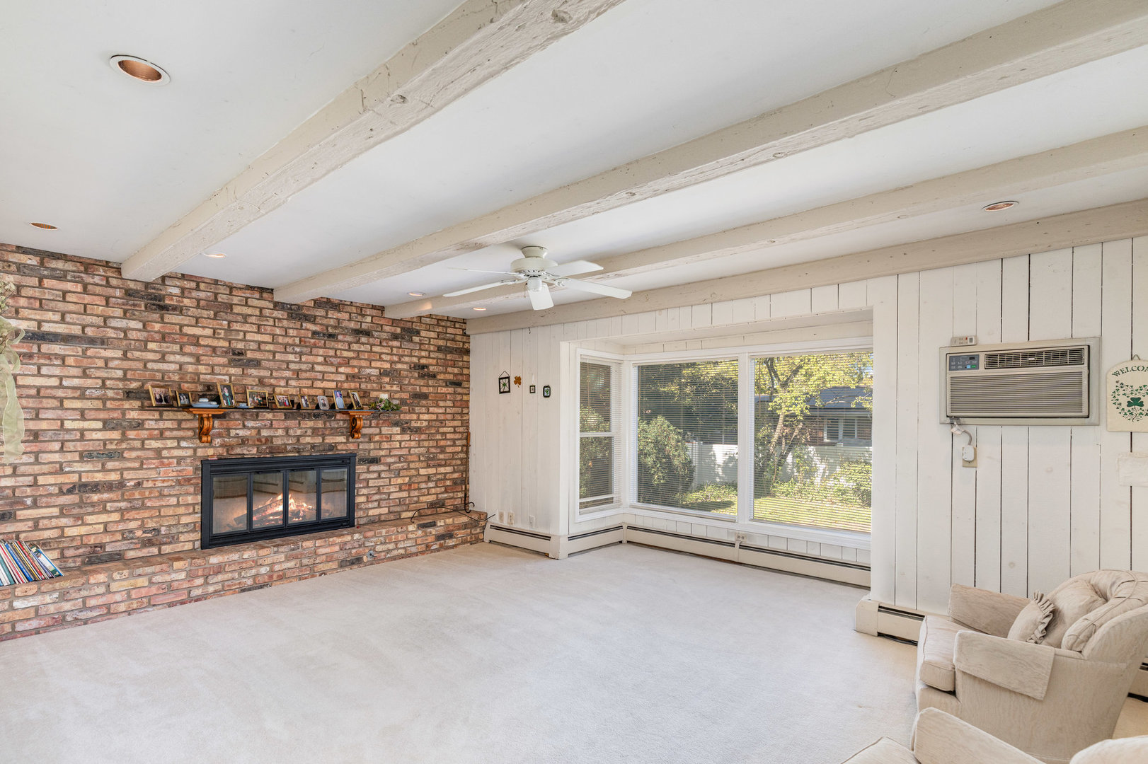 1703 West Acres Road Joliet, IL 60435 - Photo 13 of 33 a living room with furniture and a fireplace