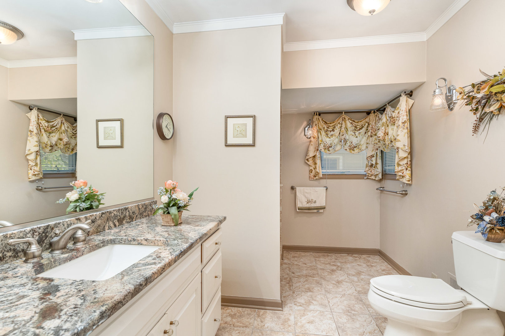 1703 West Acres Road Joliet, IL 60435 - Photo 17 of 33 a spacious bathroom with a granite countertop sink toilet and mirror