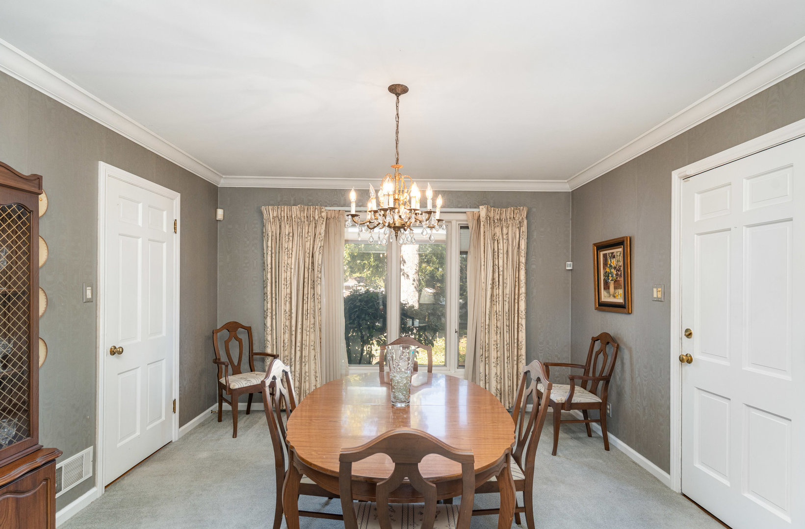 1703 West Acres Road Joliet, IL 60435 - Photo 8 of 33 a view of a dining room with furniture and chandelier