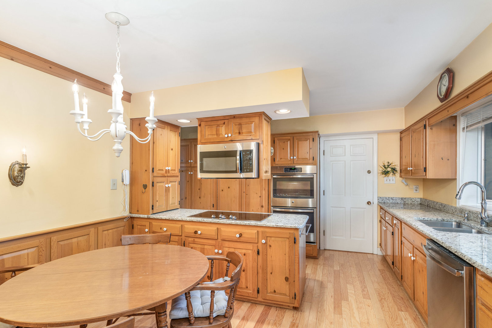 1703 West Acres Road Joliet, IL 60435 - Photo 9 of 33 a kitchen with stainless steel appliances granite countertop a sink and a refrigerator
