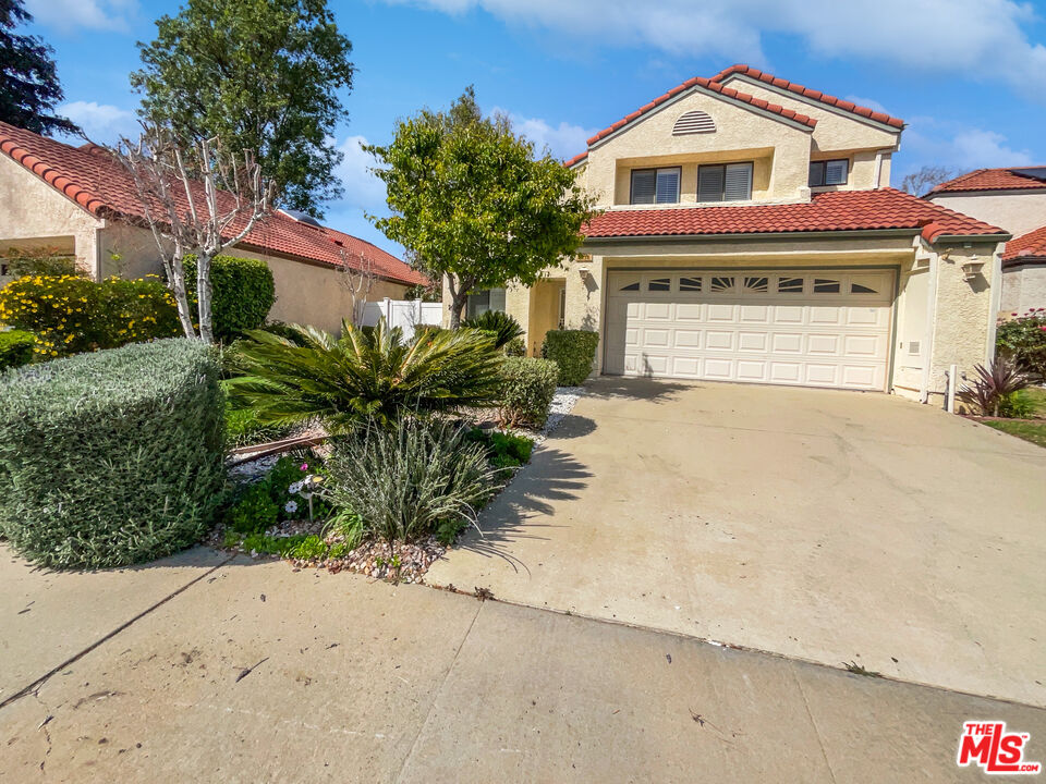 2258 Oakdale Circle Simi Valley, CA 93063 - Photo 1 of 2 a front view of a house with garden
