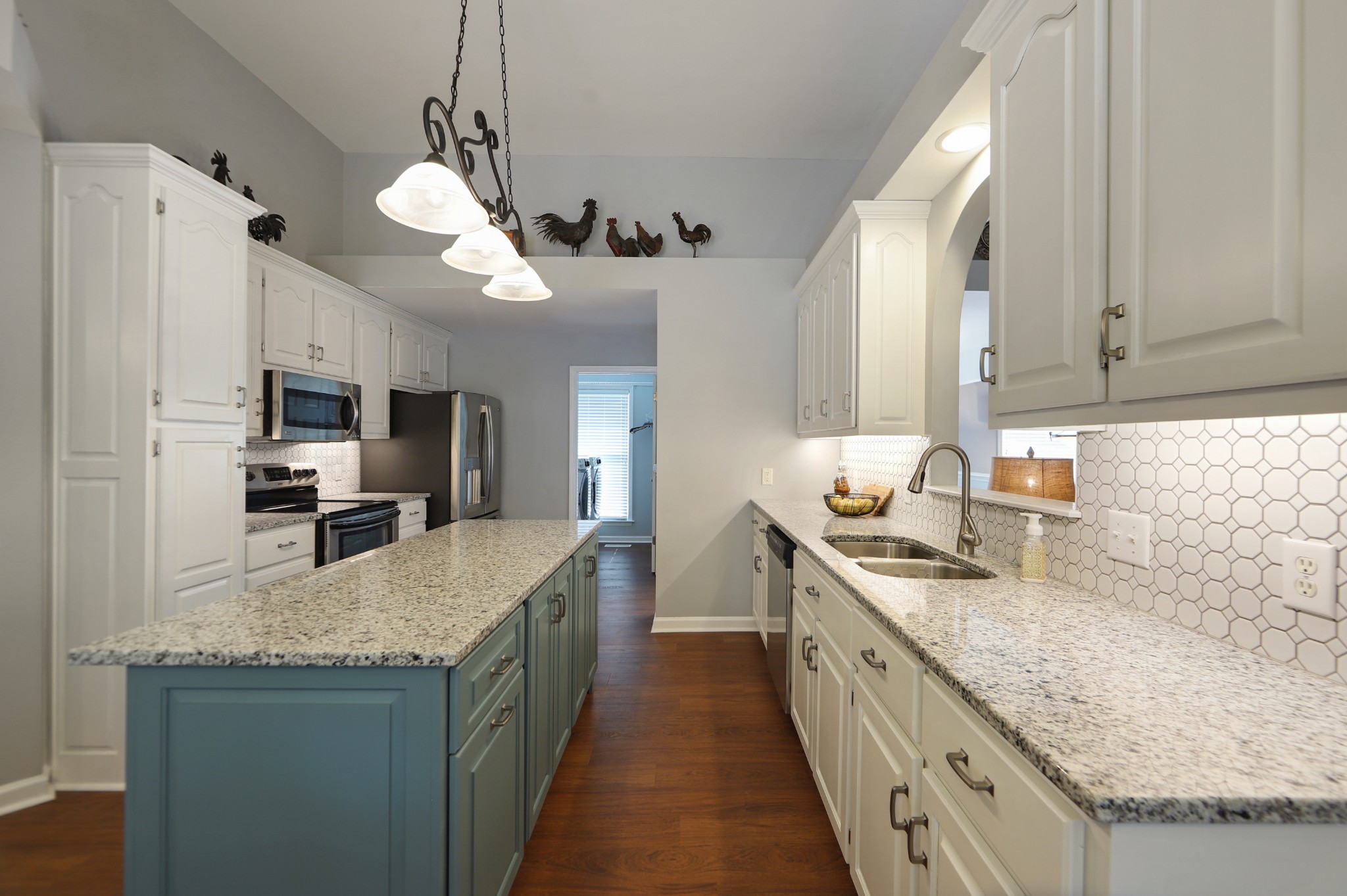832 Rands Way Columbia, TN 38401 - Photo 16 of 49 a large kitchen with granite countertop a large center island a sink stainless steel appliances and cabinets