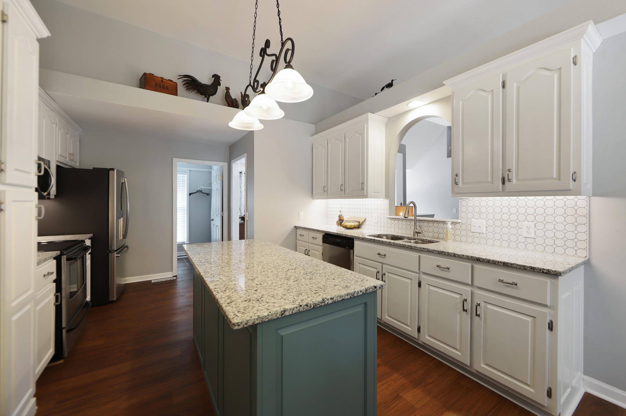 832 Rands Way Columbia, TN 38401 - Photo 17 of 49 a kitchen with granite countertop cabinets a sink dishwasher and a stove with wooden floor