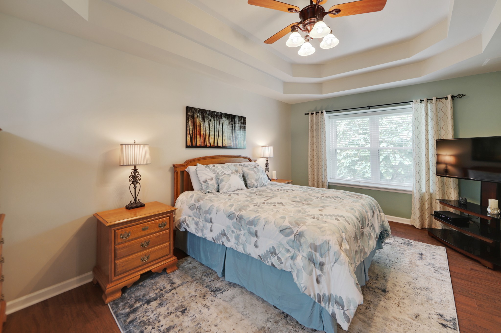 832 Rands Way Columbia, TN 38401 - Photo 21 of 49 a bedroom with a bed and a flat tv screen on dresser