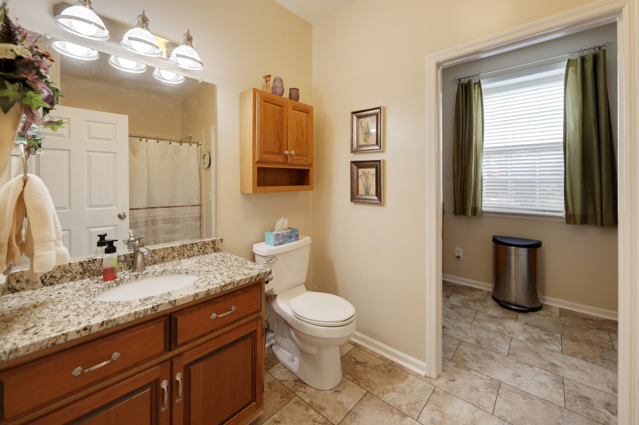 832 Rands Way Columbia, TN 38401 - Photo 38 of 49 a bathroom with a granite countertop sink a toilet and a mirror