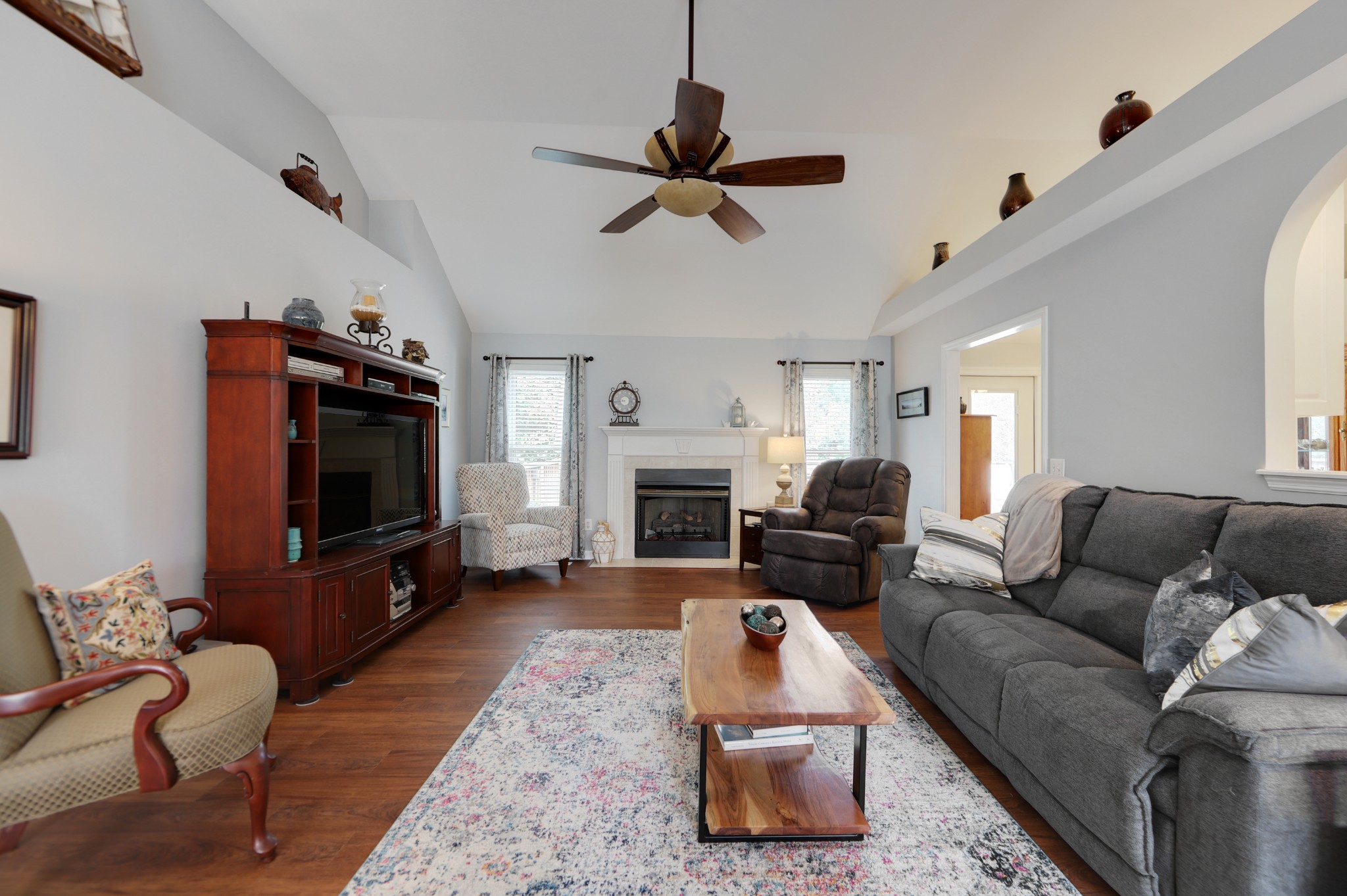 832 Rands Way Columbia, TN 38401 - Photo 10 of 49 a living room with furniture a flat screen tv and a fireplace