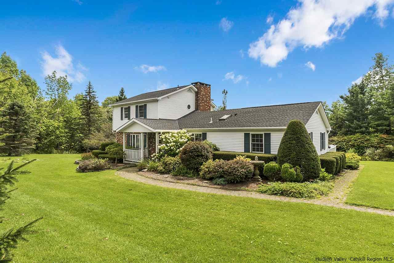 5999 Route 23c Route Prattsville, NY 12468 - Photo 1 of 31 a front view of a house with garden
