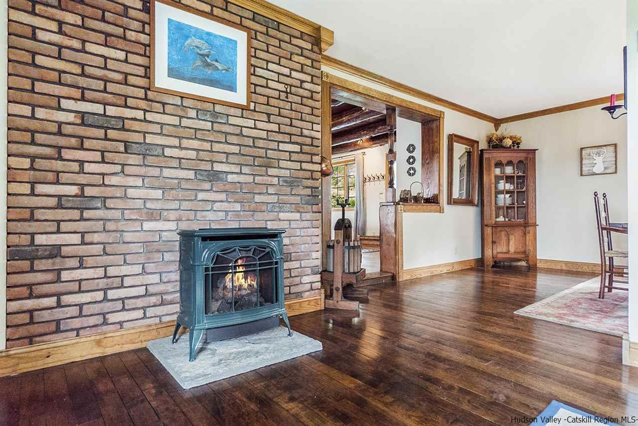5999 Route 23c Route Prattsville, NY 12468 - Photo 15 of 31 a living room with furniture and a fireplace