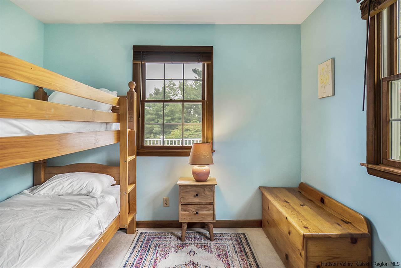 5999 Route 23c Route Prattsville, NY 12468 - Photo 23 of 31 a bedroom with a bed and a window