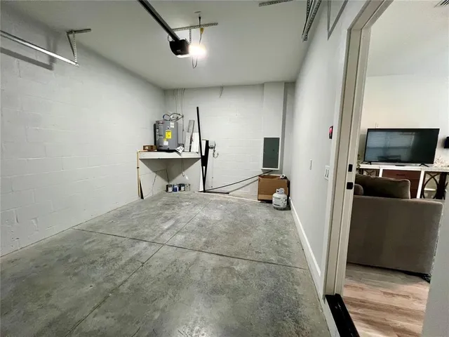 a view of a livingroom with furniture and a flat screen tv