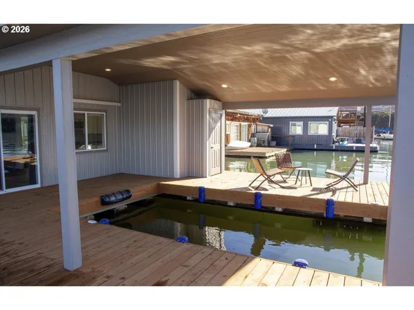 a view of swimming pool with outdoor seating