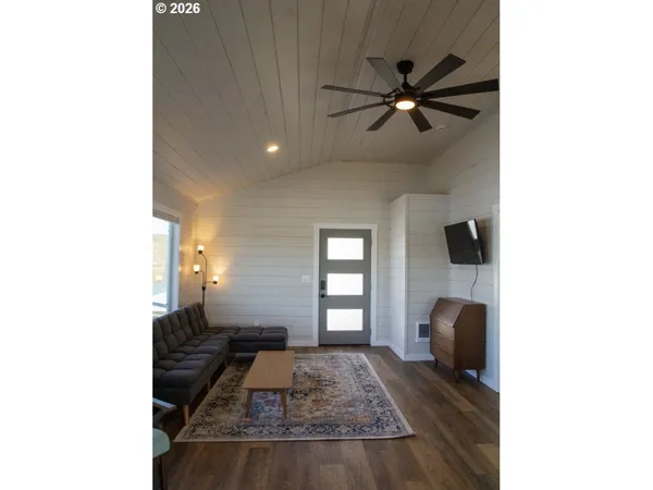 a living room with furniture and a window