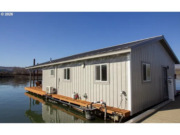 a backyard of a house with wooden fence