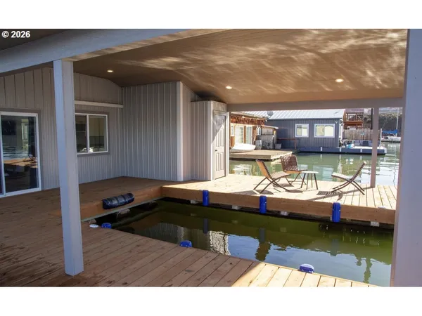 a view of swimming pool with outdoor seating
