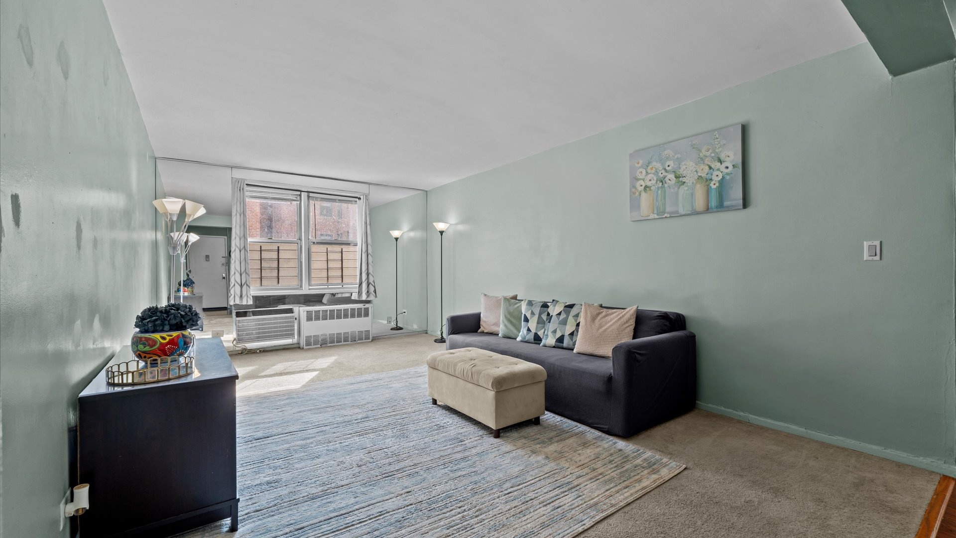 3520 Tryon Avenue, Unit 502 Bronx, NY 10467 - Photo 2 of 13 a living room with furniture and a wooden floor