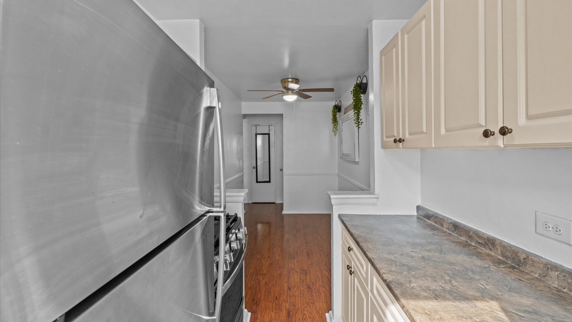 3520 Tryon Avenue, Unit 502 Bronx, NY 10467 - Photo 6 of 13 a view of a kitchen cabinets and a wooden floor
