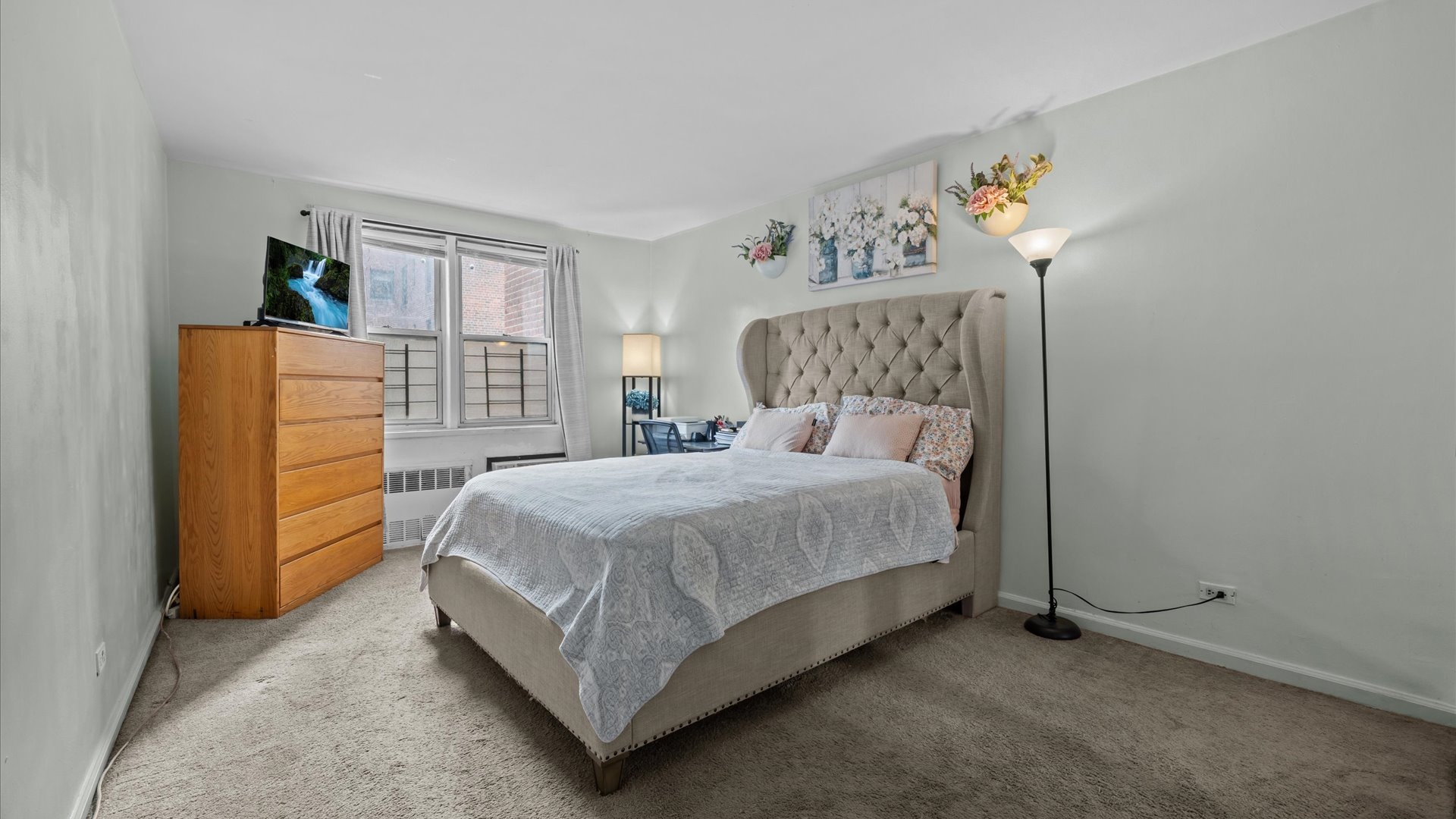 3520 Tryon Avenue, Unit 502 Bronx, NY 10467 - Photo 8 of 13 a bedroom with a bed and a window