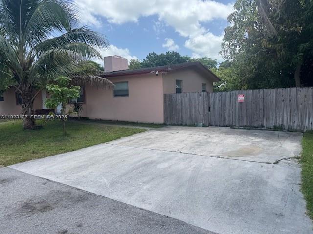 1910 Southwest 99th Avenue, Unit 1 Miramar, FL 33025 - Photo 2 of 17 a view of a backyard