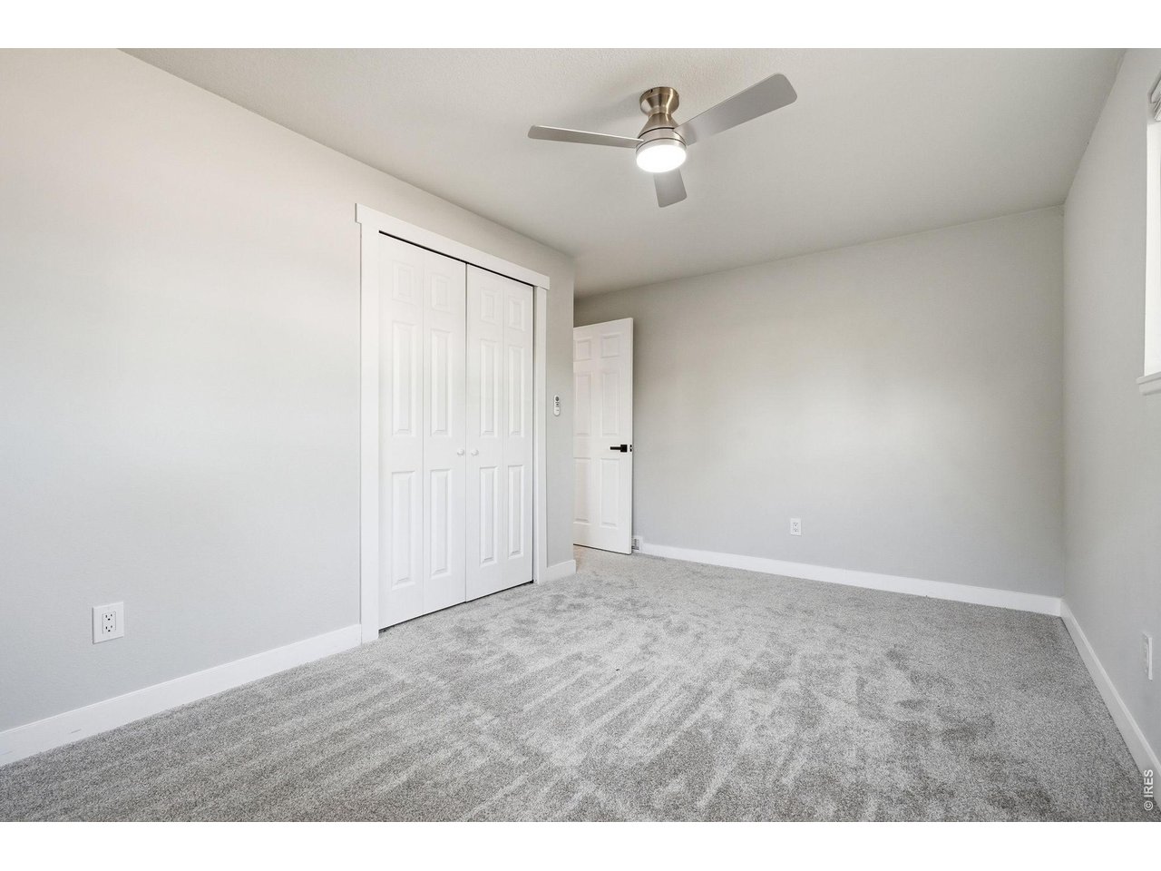 1035 6th Street Berthoud, CO 80513 - Photo 25 of 37 a view of an empty room with a fan