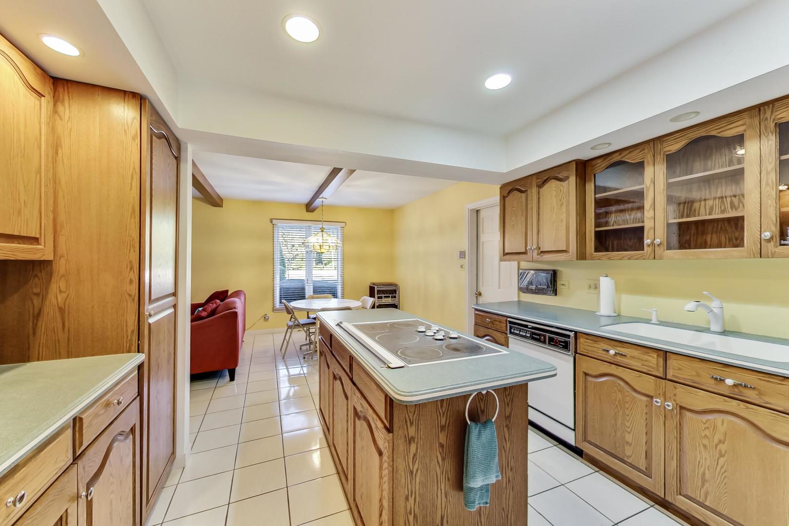 2813 Meyers Road Oak Brook, IL 60523 - Photo 13 of 62 a kitchen with stainless steel appliances granite countertop a sink and a refrigerator