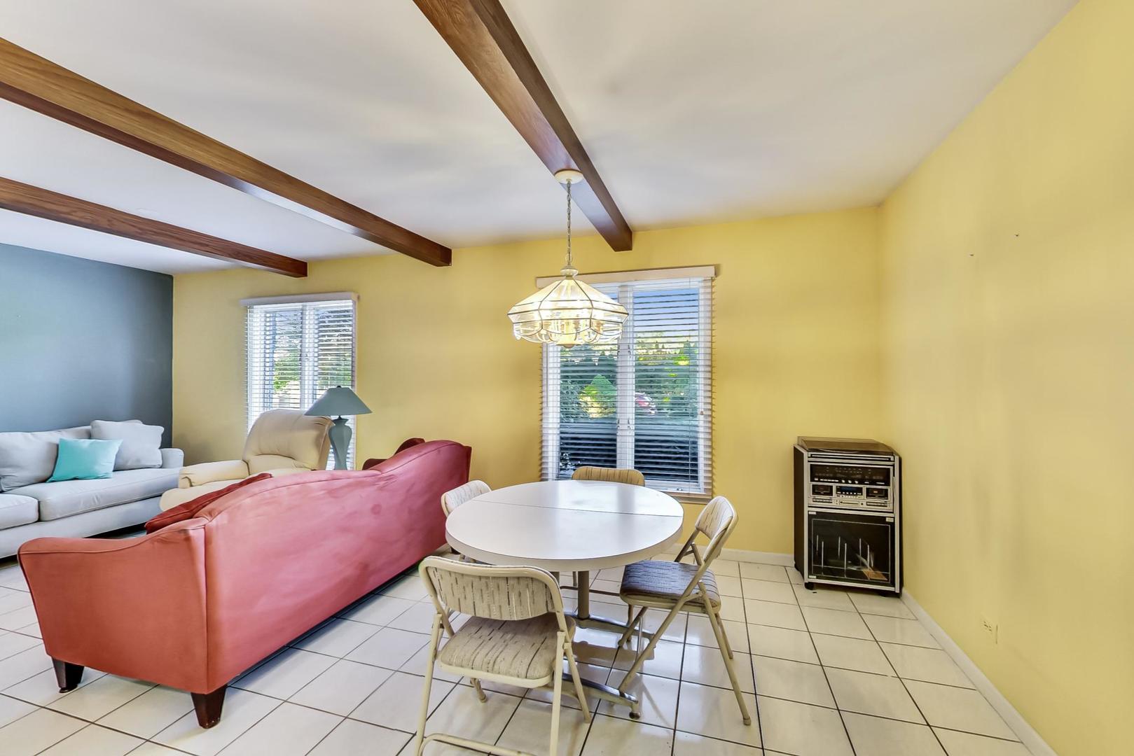 2813 Meyers Road Oak Brook, IL 60523 - Photo 14 of 62 a living room with furniture and a chandelier