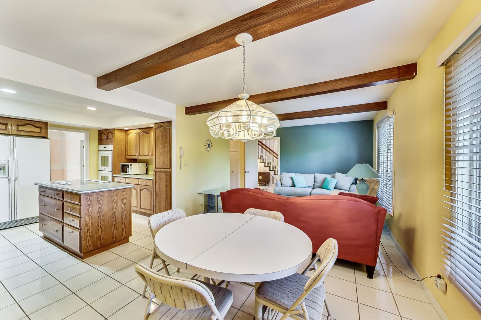 2813 Meyers Road Oak Brook, IL 60523 - Photo 15 of 62 a dining room with furniture and window