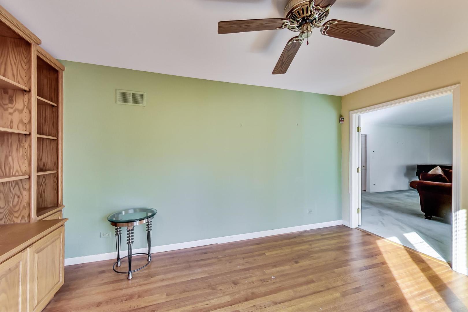2813 Meyers Road Oak Brook, IL 60523 - Photo 20 of 62 a view of a room with wooden floor and staircase