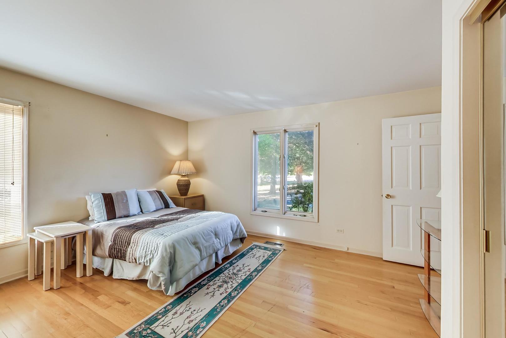 2813 Meyers Road Oak Brook, IL 60523 - Photo 23 of 62 a bedroom with a bed and window