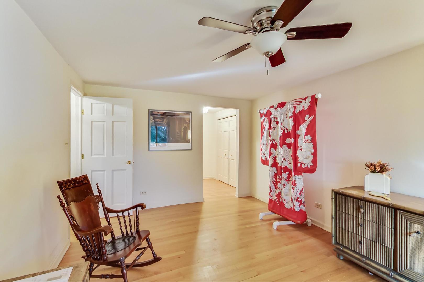 2813 Meyers Road Oak Brook, IL 60523 - Photo 39 of 62 a view of a livingroom with furniture and a ceiling fan