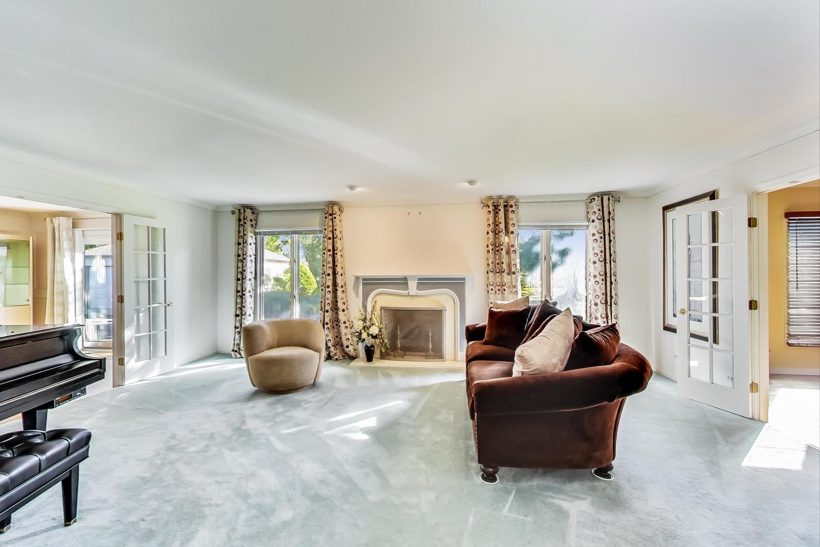 2813 Meyers Road Oak Brook, IL 60523 - Photo 5 of 62 a living room with furniture and a fireplace