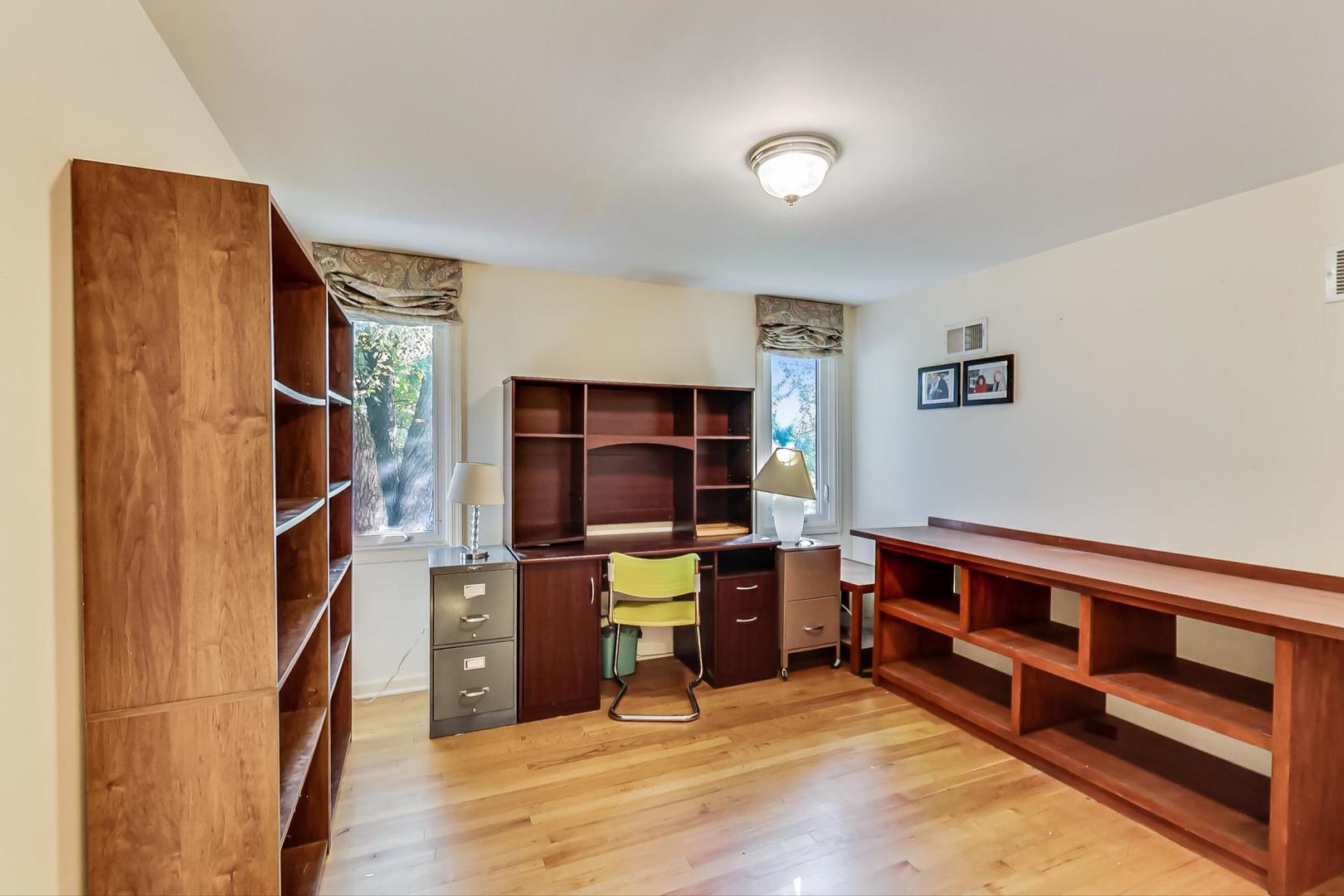 2813 Meyers Road Oak Brook, IL 60523 - Photo 41 of 62 a view of a workspace with furniture and wooden floor