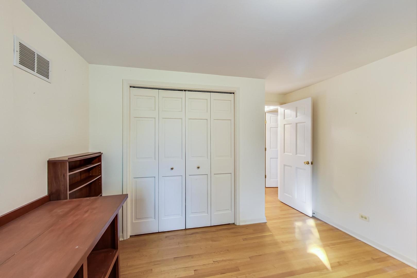 2813 Meyers Road Oak Brook, IL 60523 - Photo 43 of 62 a view of a room with wooden floor and cabinet