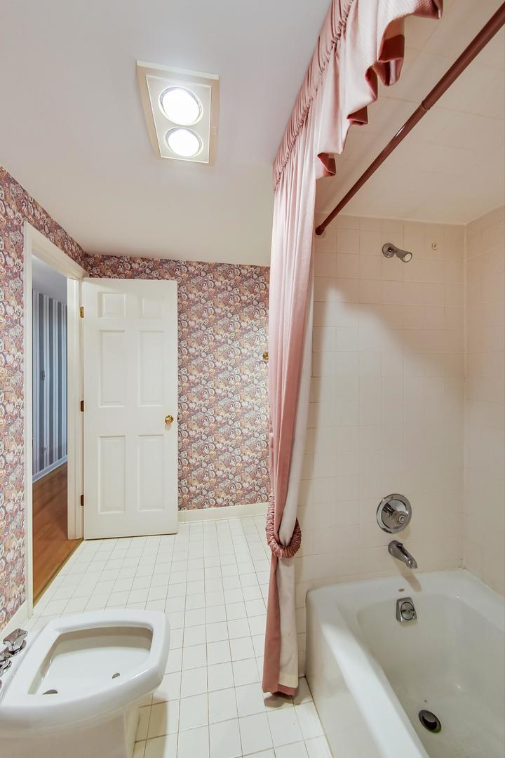 2813 Meyers Road Oak Brook, IL 60523 - Photo 45 of 62 a bathroom with a sink a toilet and shower