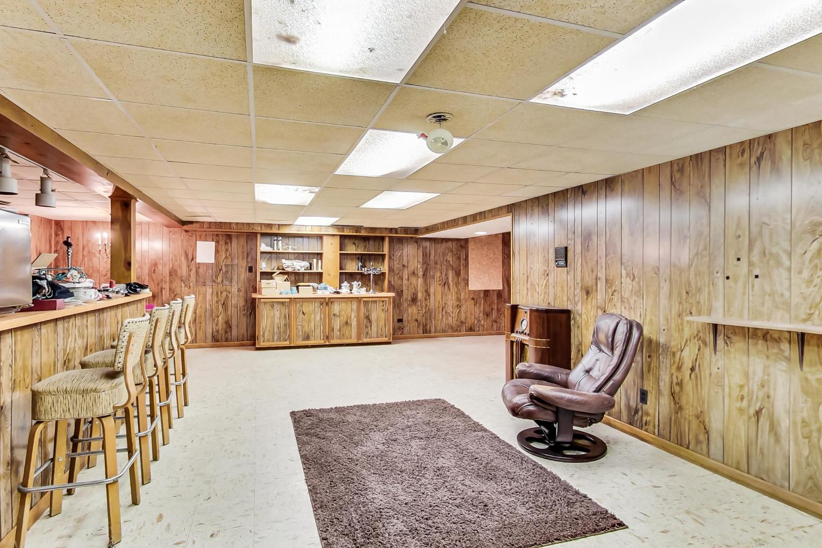 2813 Meyers Road Oak Brook, IL 60523 - Photo 46 of 62 a living room with furniture and a rug