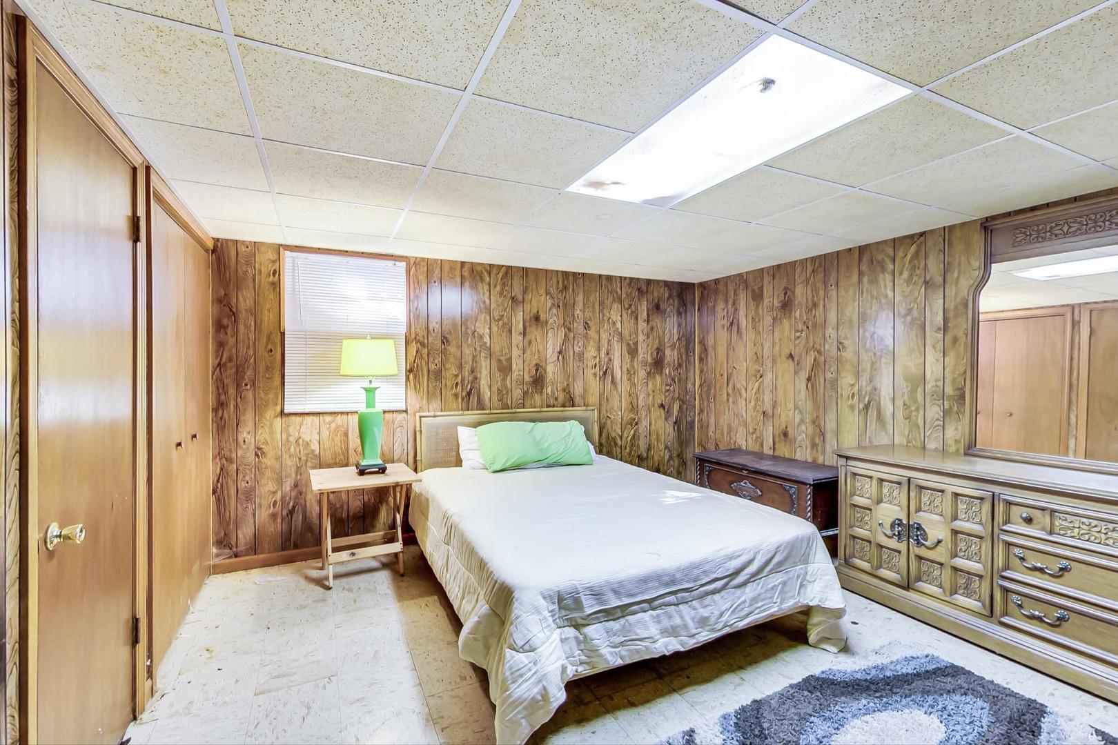 2813 Meyers Road Oak Brook, IL 60523 - Photo 51 of 62 a bedroom with a bed and wooden floor