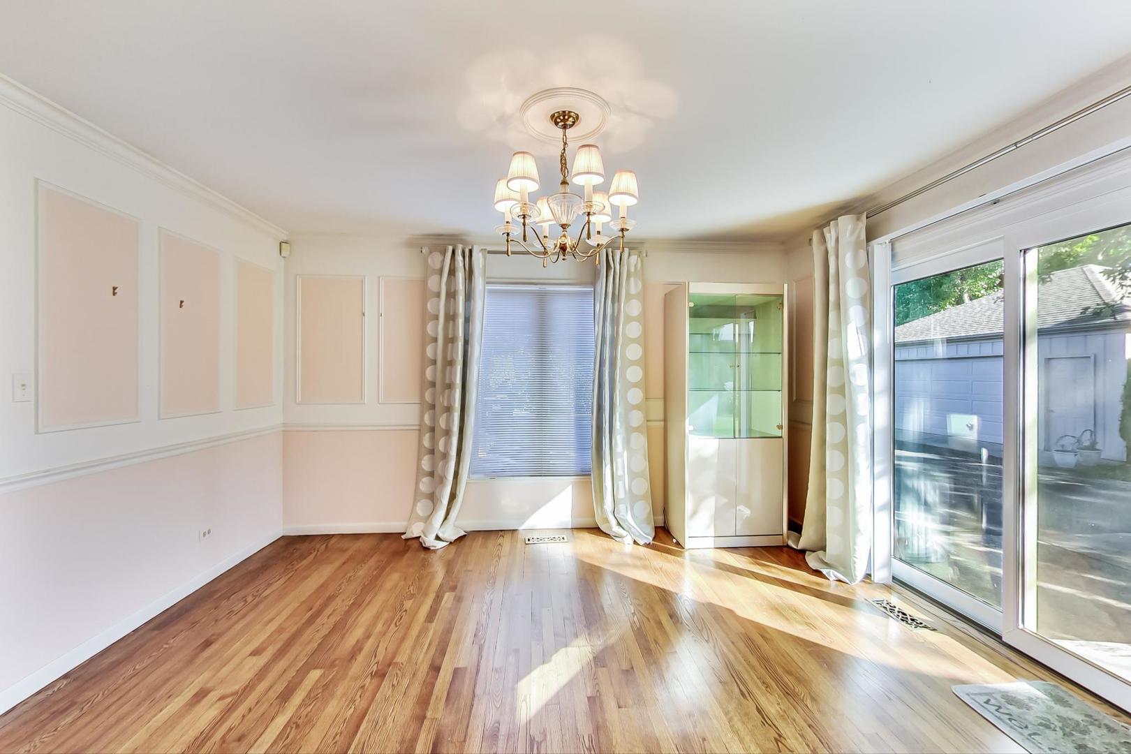 2813 Meyers Road Oak Brook, IL 60523 - Photo 8 of 62 wooden floor in an empty room with a window