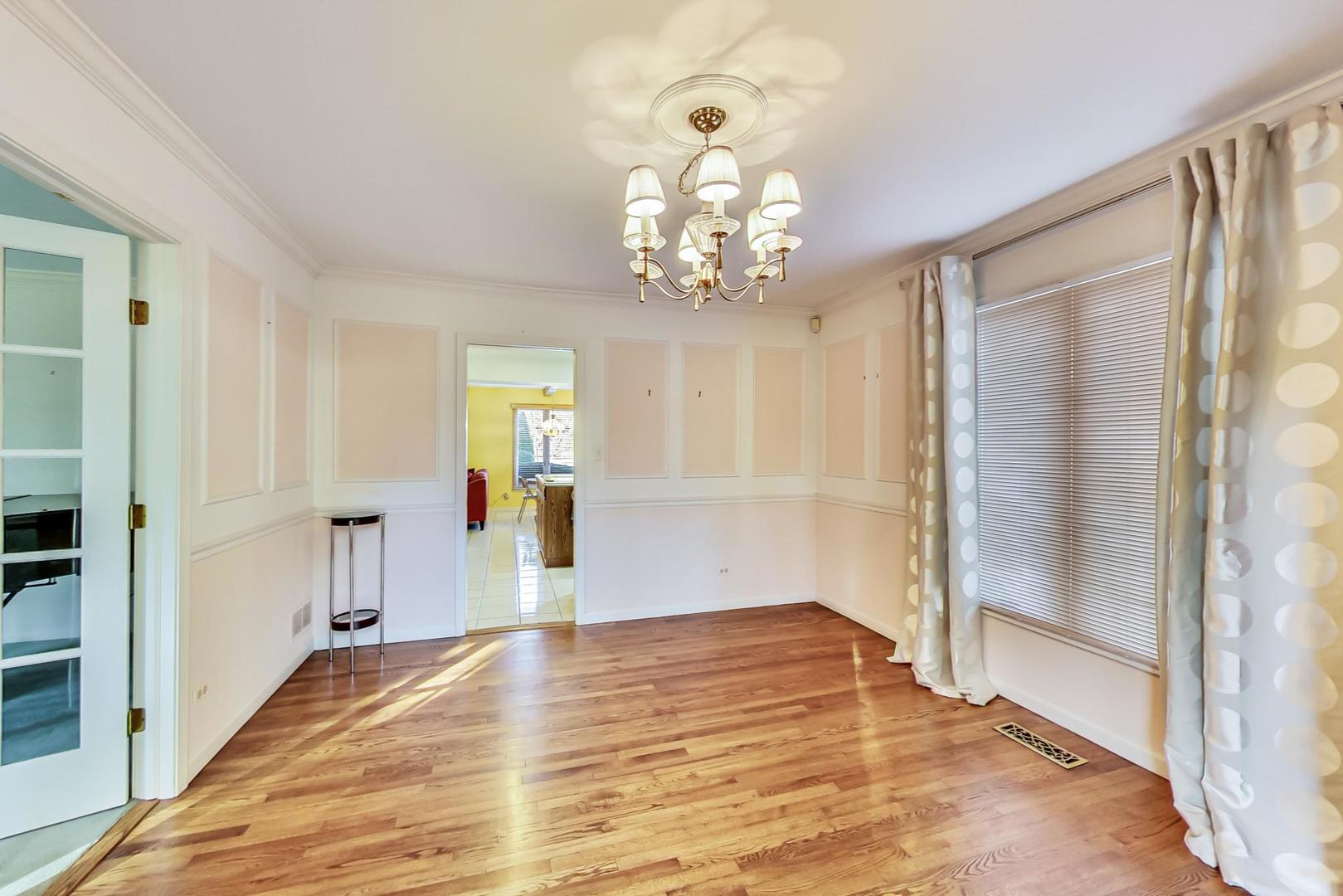 2813 Meyers Road Oak Brook, IL 60523 - Photo 10 of 62 a big room with wooden floor mirror and a bathroom