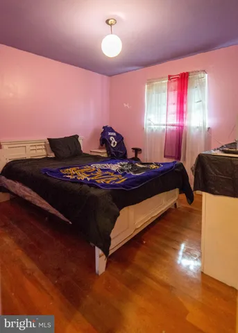 a bedroom with furniture and window