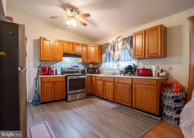 a kitchen with sink cabinets and window