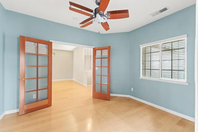 a view of an empty room with a window