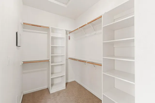 a view of an empty walk in closet