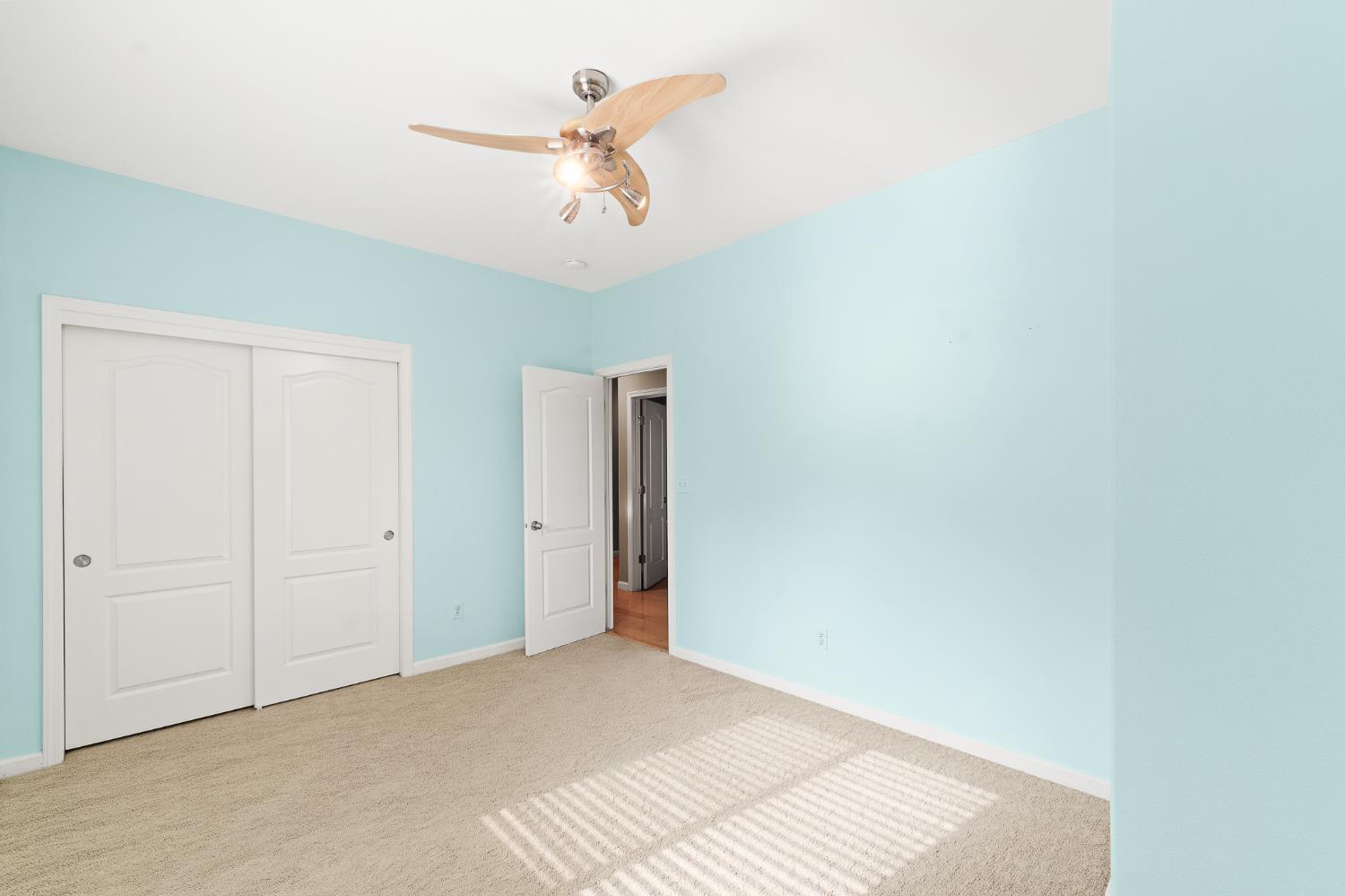 783 Bodega Avenue Lemoore, CA 93245 - Photo 27 of 35 a view of a room with a ceiling fan