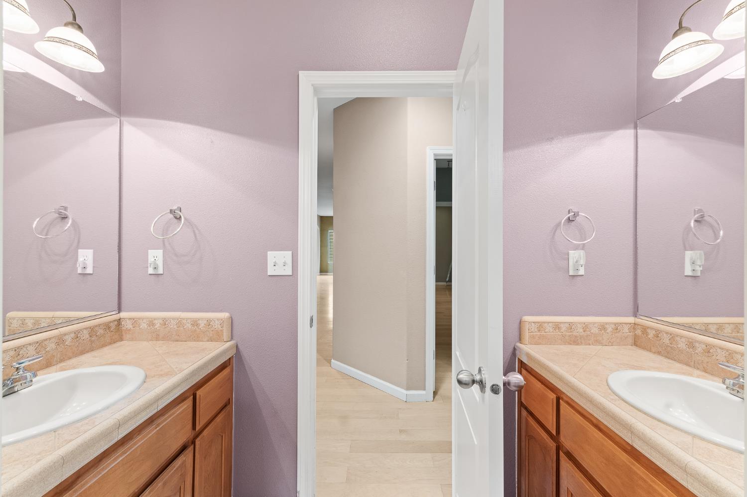 783 Bodega Avenue Lemoore, CA 93245 - Photo 29 of 35 a bathroom with a granite countertop sink shower and a mirror