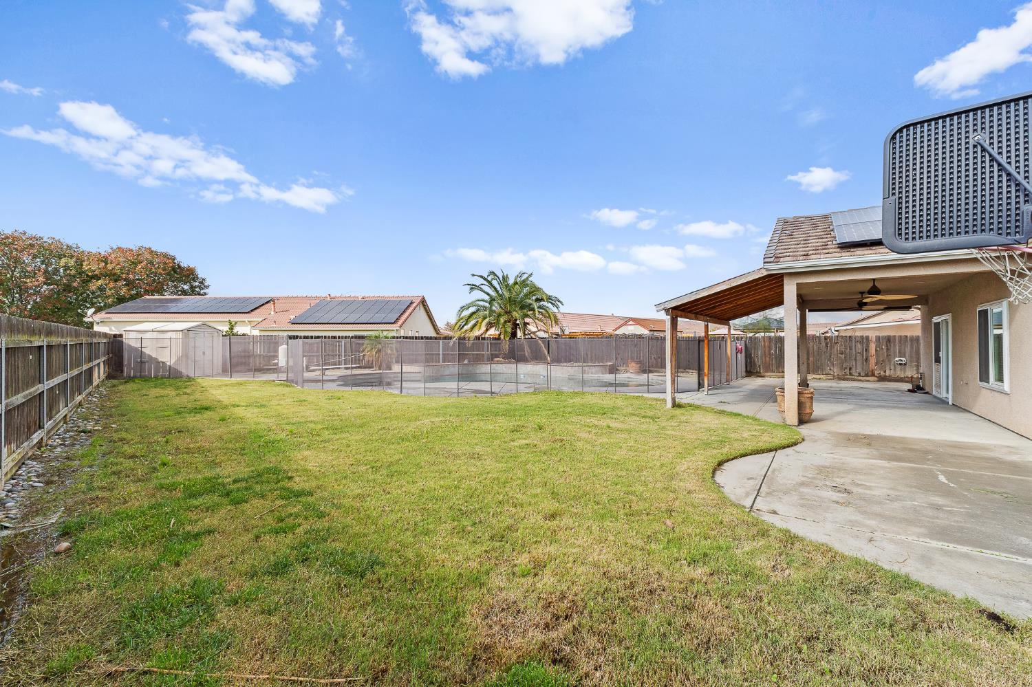783 Bodega Avenue Lemoore, CA 93245 - Photo 32 of 35 a swimming pool with outdoor seating and yard
