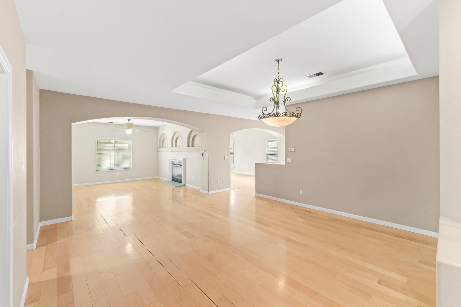 783 Bodega Avenue Lemoore, CA 93245 - Photo 4 of 35 wooden floor in an empty room with a window
